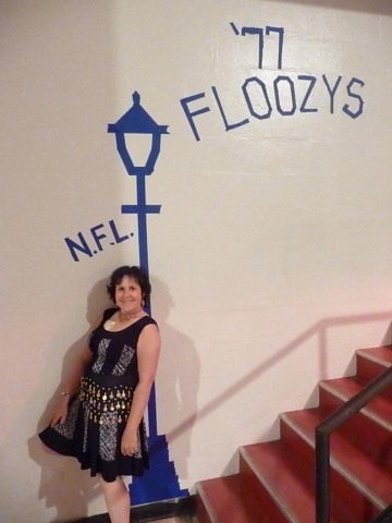 Debbie (Arnold) shows off our artwork!  N.F.L. = National Floozy League!