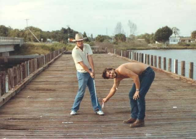 Tom Burry addresses the crab.  Caddy is Dean Erskine.