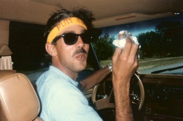 Shawn Wilkes enjoys a snack on the long ride home from surfing